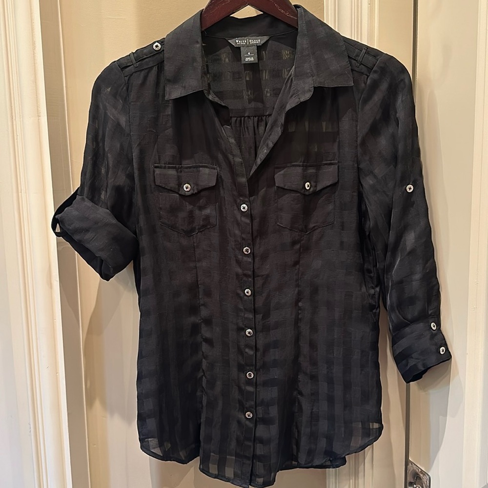 Slightly sheer black blouse.